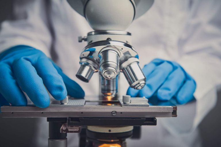 Close-up shot of microscope with metal lens.